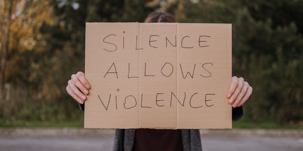 'Silence allows violence' full-width pic